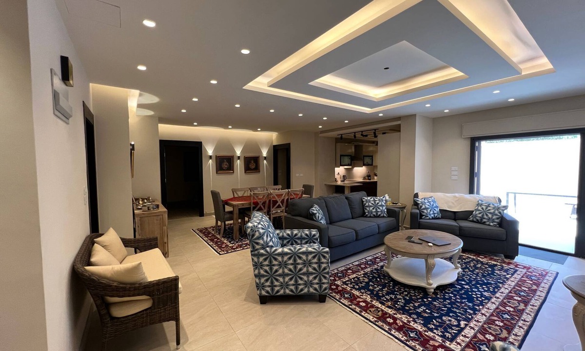 Sahab Apartment | 3 bed room apartment with modern kitchen indoor and out door seating area .