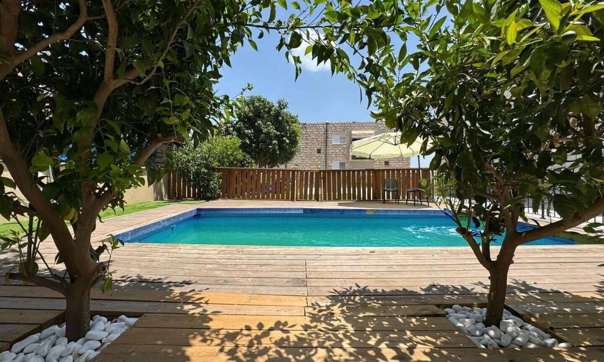 Tiberias Apartment | A spectacular villa with 12 bedrooms in 6 separate units, a spacious living room, a fully equipped kitchen, a barbecue area and a heated pool. The villa also features a luxurious rooftop jacuzzi, a football table, ping pong,