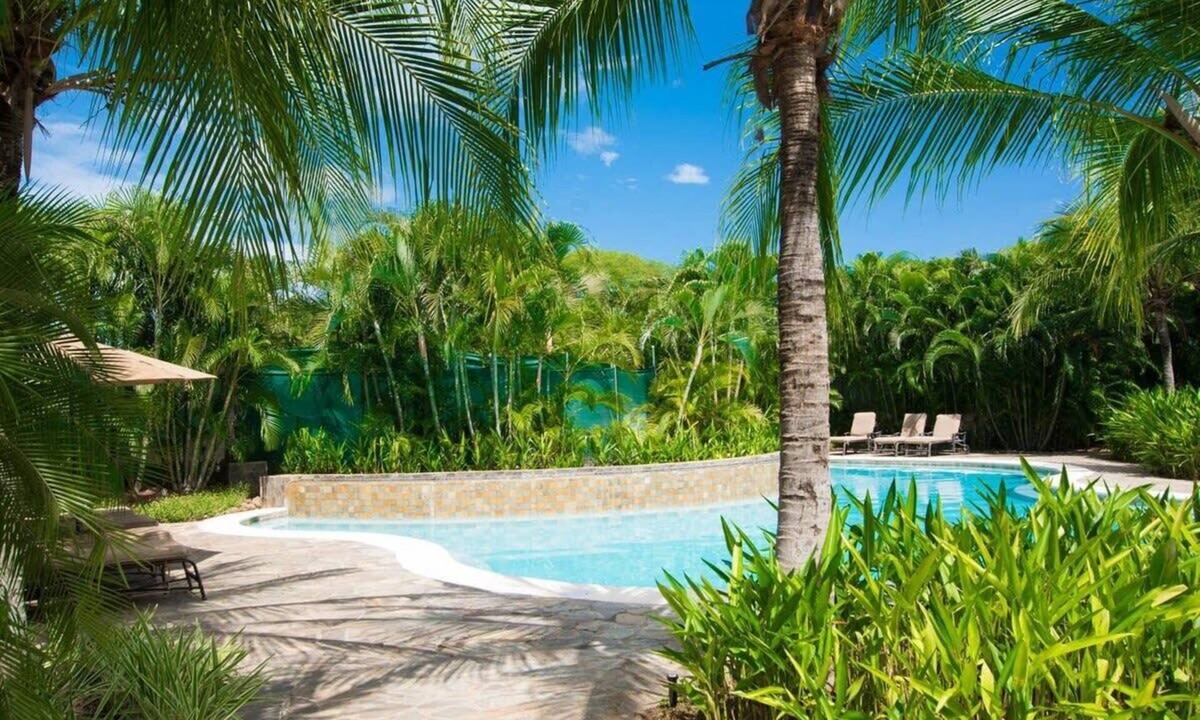 Coco Condo | Colorful Poolside Condo w/Garden-View Patio & Resort-Style Amenities