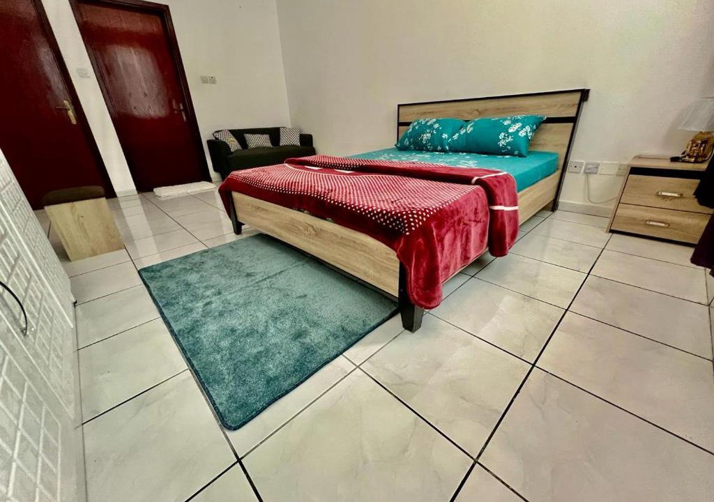 Al Majaz House | Luxury Awaits: Master Bedroom for Rent! Indulge in comfort and style.