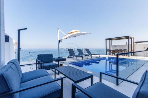 Sharm Apartment | Overlooking Pool, Mountain and Sea 6BR Villa with Two Assistant Room, Heated Pool, BBQ Area, Al Dana Island, Fujairah by Deluxe Holiday Homes