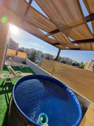 Amman Apartment | Rooftop pool with terraces F-R