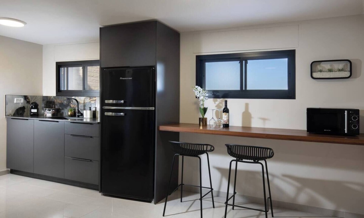 Tiberias Apartment | This cozy apartment offers ample space, featuring a comfortable living room perfect for relaxation