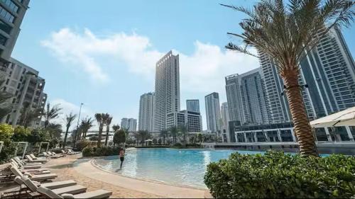 Madinat Zayed Apartment | Vogue Vacation Homes, Creek Beach Rosewater Waterfront Living close to Downtown, Burj Khalifa and Dubai mall, Two Bedroom Apartment with Balcony and Vibrant Community View, Private Manmade Beach, Access to all Amenities