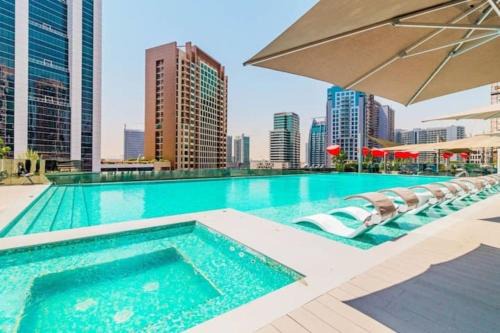 Madinat Zayed Apartment | Vogue Vacation Homes, Downtown Mag318 near Burj Khalifa and Dubai Mall, Studio Apartment with Balcony, Canal and City View, Access to all Amenities