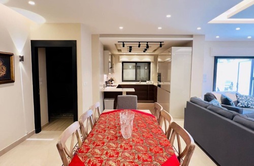 Sahab Apartment | 3 bed room apartment with modern kitchen indoor and out door seating area .