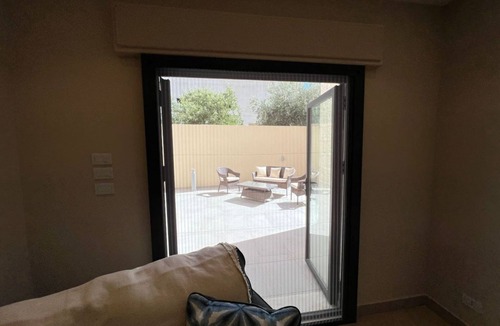 Sahab Apartment | 3 bed room apartment with modern kitchen indoor and out door seating area .
