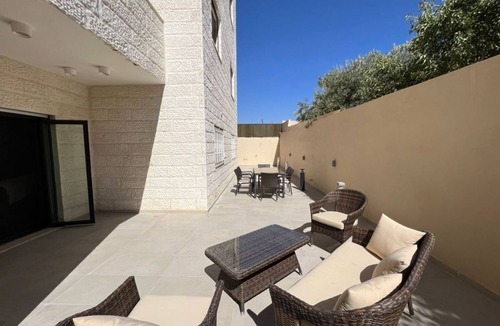 Sahab Apartment | 3 bed room apartment with modern kitchen indoor and out door seating area .