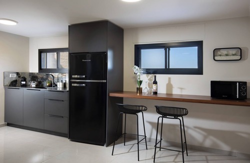 Tiberias Apartment | A spectacular villa with 12 bedrooms in 6 separate units, a spacious living room, a fully equipped kitchen, a barbecue area and a heated pool. The villa also features a luxurious rooftop jacuzzi, a football table, ping pong,