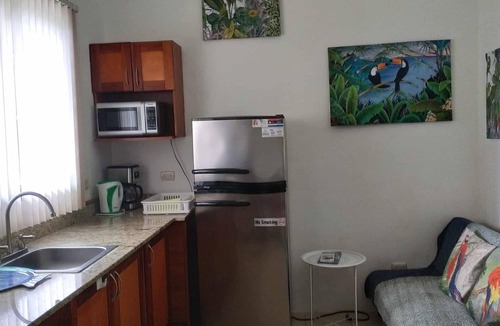 Coco Sunset Hills Apartment | A tropical beach is a three-minute walk away