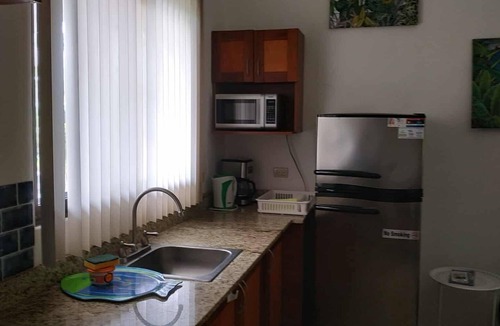 Coco Sunset Hills Apartment | A tropical beach is a three-minute walk away