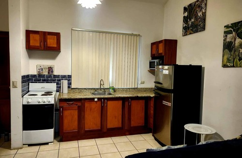 Coco Sunset Hills Apartment | A tropical beach is a three-minute walk away