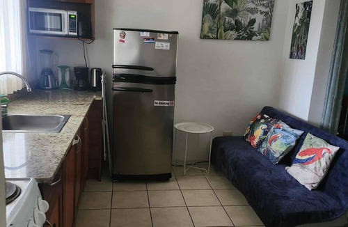 Coco Sunset Hills Apartment | A tropical beach is a three-minute walk away