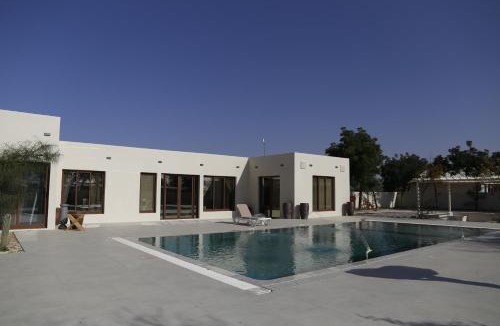 Abu Dhabi Ski Chalet | Al Ain Farm Escape with Private Pool , Mini Golf , and Firepit