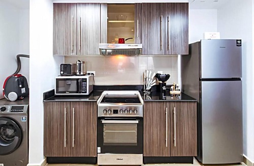 Abu Dhabi Apartment | Al Reef 1BR - Cozy Serene Luxe Retreat