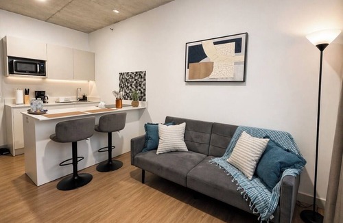 La California Apartment | Balcony with a panoramic view on the 27th floor in Barrio Escalante