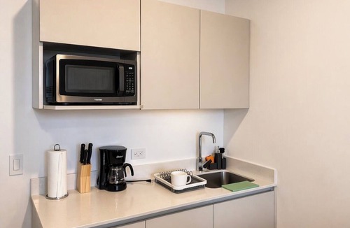 La California Apartment | Balcony with a panoramic view on the 27th floor in Barrio Escalante
