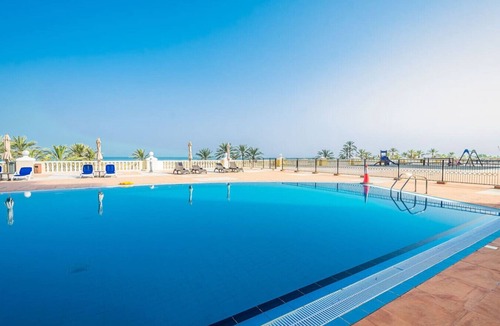 Al Hamra Village Apartment | Beachside Bliss Getaway