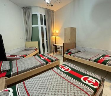 Barsha Heights Apartment | Bed in mixed room