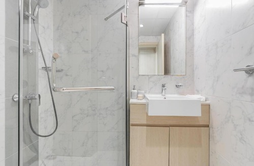 Dubai Production City Apartment | Bright and Modern 1BR Midtown Near Expo Site by Vibel