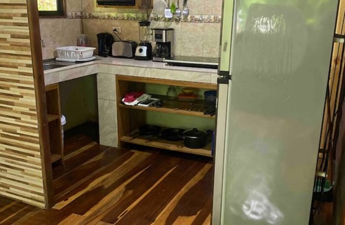 Penas Blancas Cabin | Cabin in La Fortuna with rustic finishes, river and forest