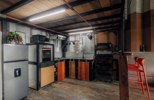 Jaco House | Cozy tropical/industrial quonset located in a secondary tropical forest.