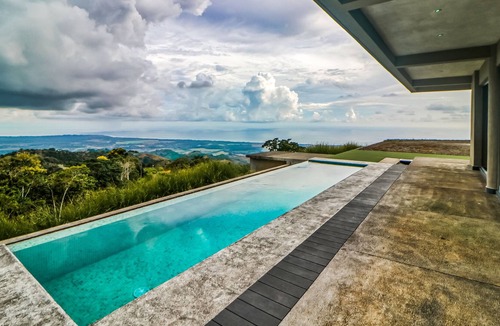 Jaco House | Dog-friendly home with sweeping views, infinity pool, terrace, & washer/dryer