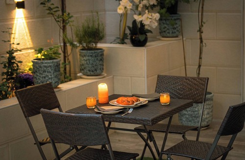 Suwailih Apartment | Elegant 2BR Family Oasis with Lush Private Garden