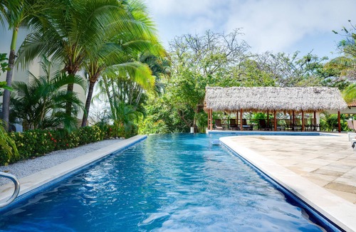 Playa Flamingo Apartment | Fabulous ocean-view apartment with balcony, pool, grill, & full kitchen