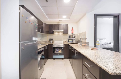 Dubai Sports City Apartment | Free housekeeping visits during your stay - StayShort - Charming & Bright 1BR in Red Residence Dubai Sports City