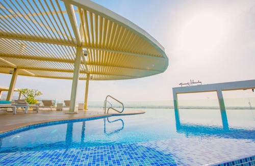 Muscat Hotel | Grand Millennium Muscat connected to Muscat Grand Mall