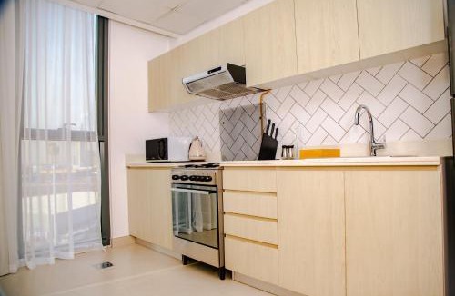 Dubai Production City Apartment | Green community - Tennis, streetball - 15 mins sea