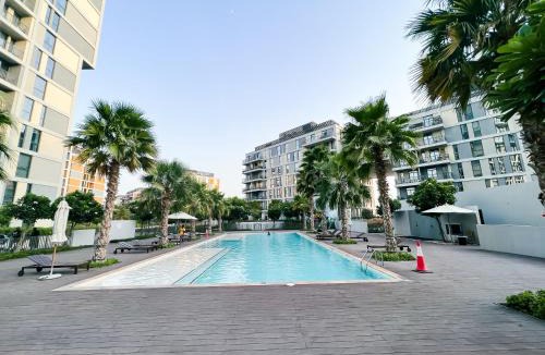 Dubai Production City Apartment | Green community - Tennis, streetball - 15 mins sea