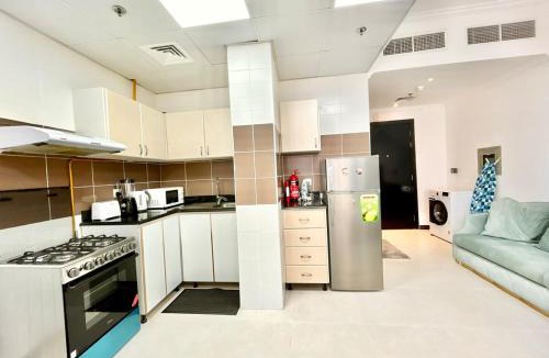 Jumeirah Village Triangle Apartment | Homes2Retreat - Modern Studio with Balcony in JVT