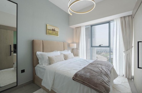 Dubai Apartment | KeyRock Golf Gate - Stylish Retreat with Pool and Gym