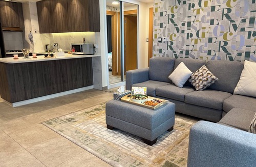 Al Abdali Apartment | Live in the heart of Amman with this luxury one-bedroom suite featuring two balc