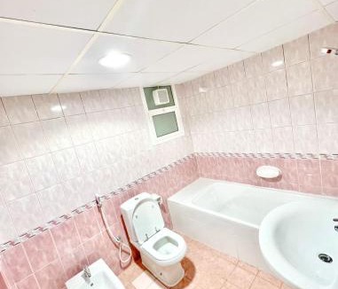 Al Majaz House | Luxury Awaits: Master Bedroom for Rent! Indulge in comfort and style.