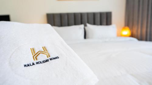Al Hamra Village Apartment | Marina Luxe Escape by Hala Holiday Homes