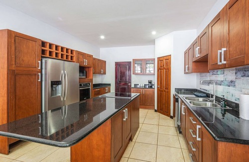 Camaronal House | Modern gated mountain villa in Tarcoles with a private pool, tropical surroundings, fast WiFi, Smart TVs, and spacious indoor living. Perfectly located near Carara National Park, Jacó, Playa Mantas, and Los Sueños Marina.