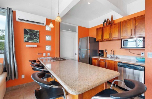 Coco Condo | Modern Top-Floor Condo with Panoramic Views and Community Pool