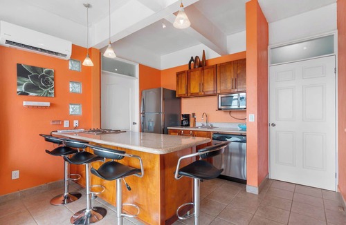 Coco Condo | Modern Top-Floor Condo with Panoramic Views and Community Pool