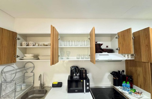 Masdar City Apartment | Palm Grove: Elegant 2BR Oasis