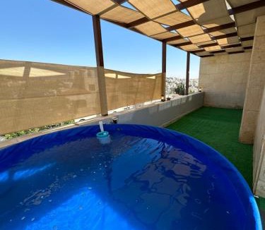 Amman Apartment | Rooftop pool with terraces F-R