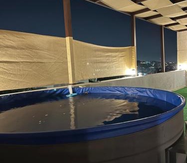 Amman Apartment | Rooftop pool with terraces F-R