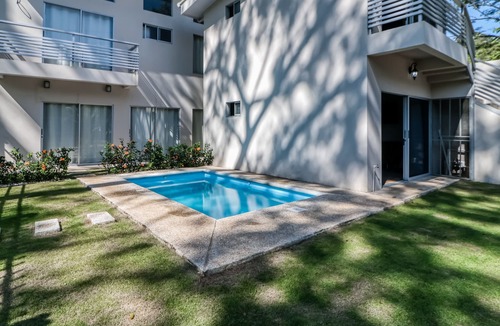 Jaco Apartment | Second Floor Studio with Shared Pool, Partial AC, and Private Washer/Dryer!