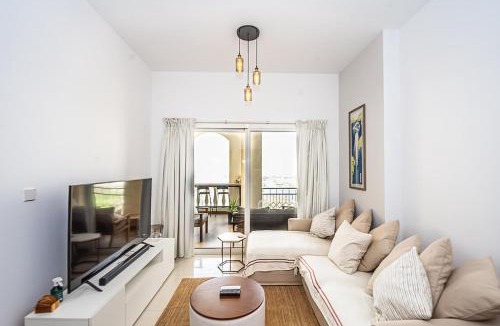 Al Hamra Village Apartment | Serene Lagoon Escape