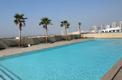 Jumeirah Village Triangle Apartment | Skyline Views: Sunset Studio with Balcony