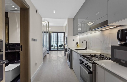 Business Bay Apartment | Studio Retreat with Canal and Burj Khalifa Views