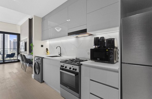 Business Bay Apartment | Studio Retreat with Canal and Burj Khalifa Views
