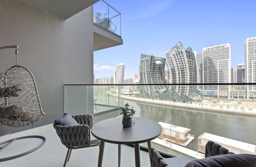Business Bay Apartment | Studio Retreat with Canal and Burj Khalifa Views
